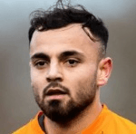 Дж. Асекзай