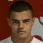 Дж. Максимович